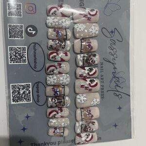 Holiday Press-On Nails with Santa and Snowflake Design